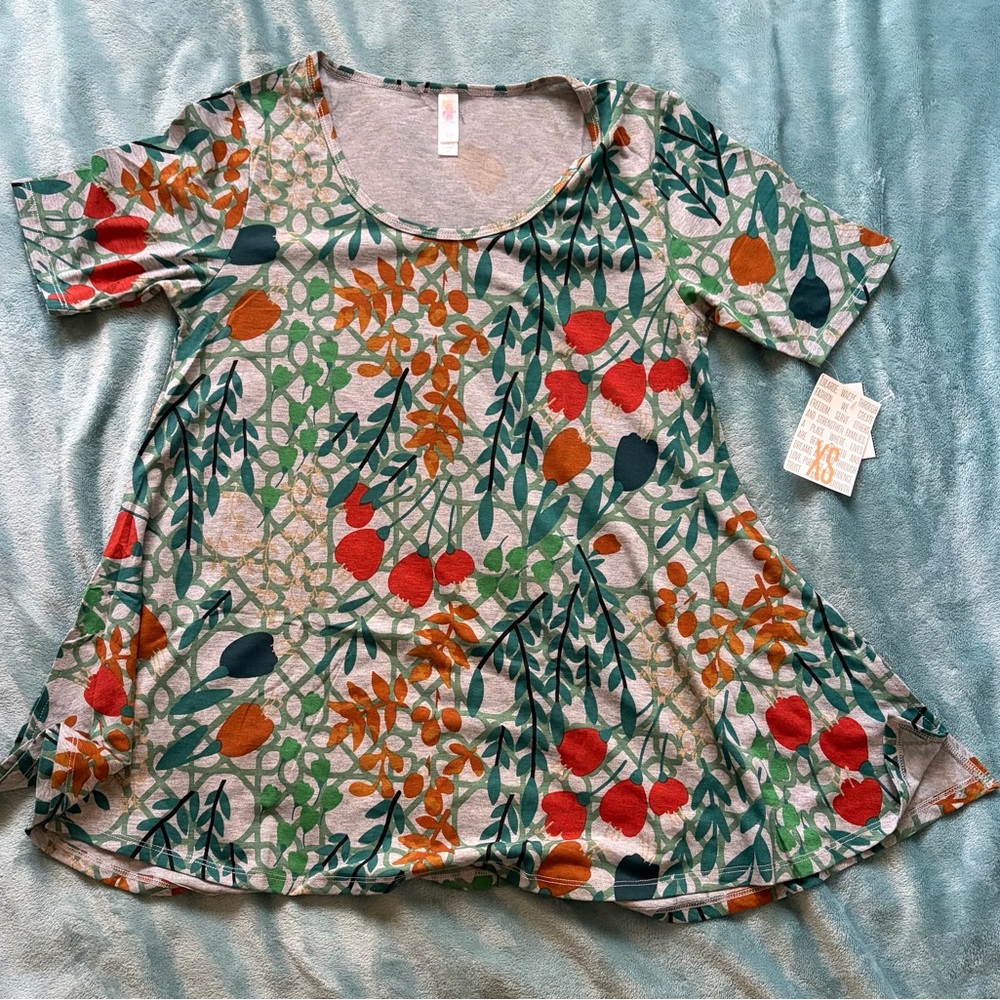 LuLaRoe Short Sleeve Top with Red, Orange, and Green Floral Design